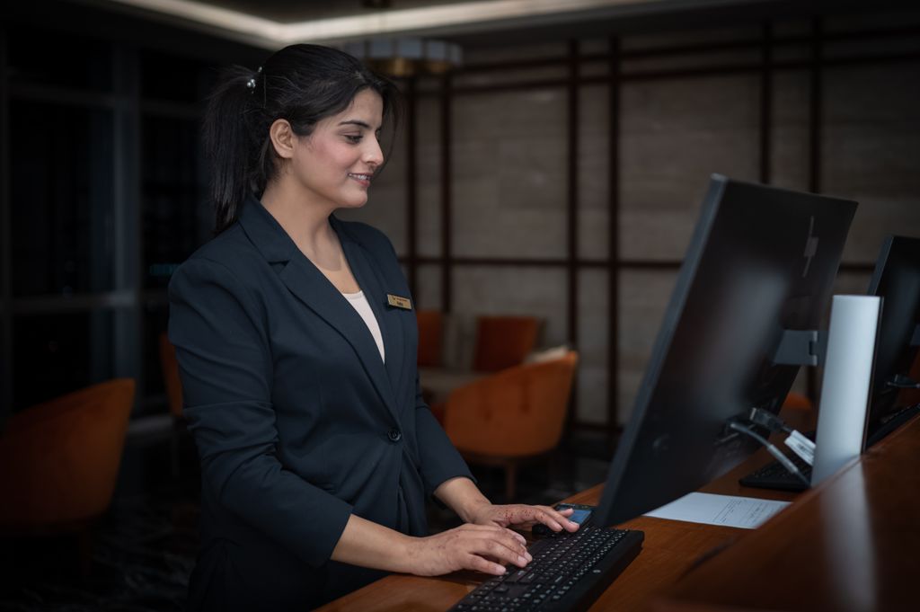 Hotel manager reviewing guest feedback during a guest stay